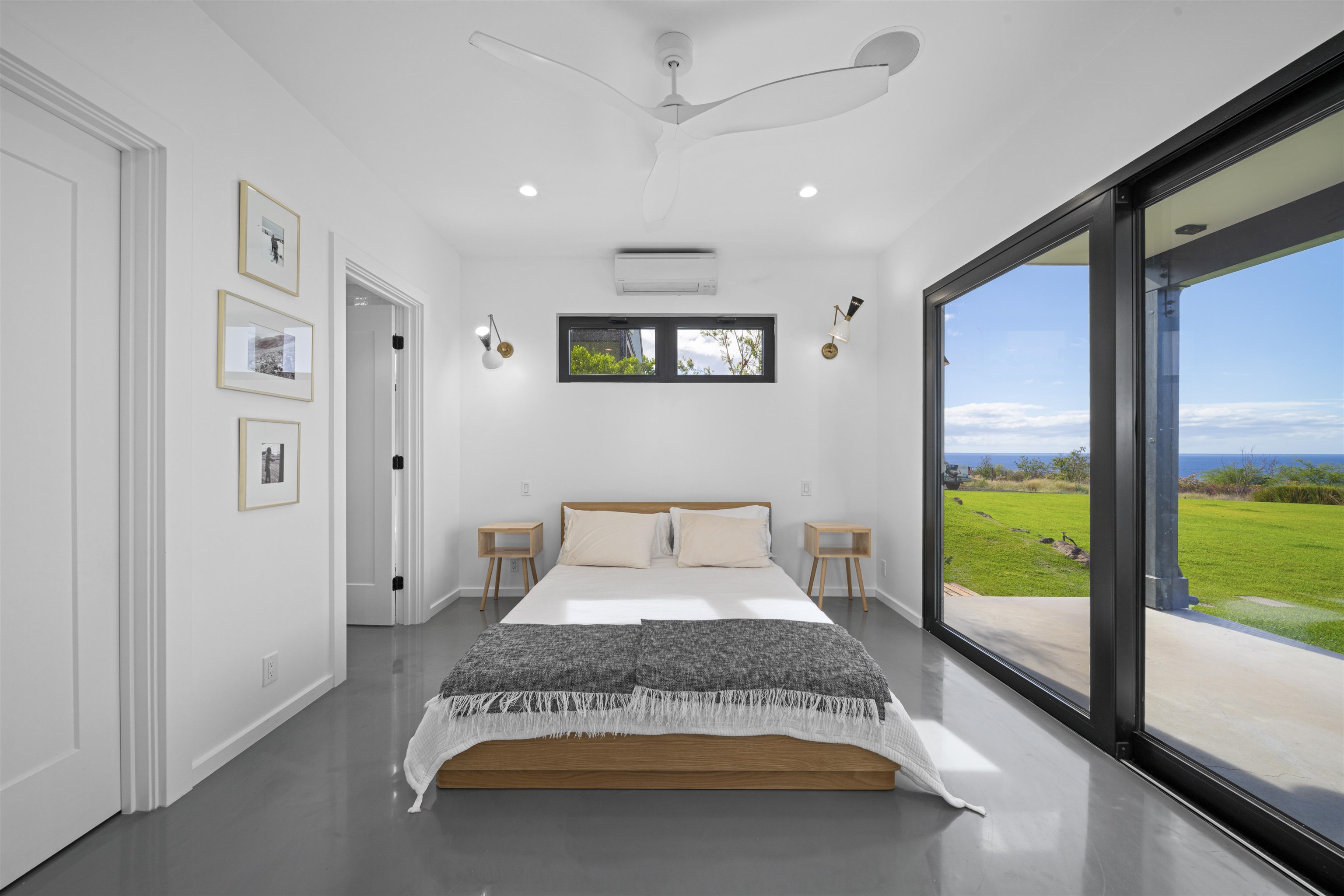 153 Haniu Street, Unit B Lahaina, HI 96761 - Photo 24 of 41 a bedroom with a bed and a large window