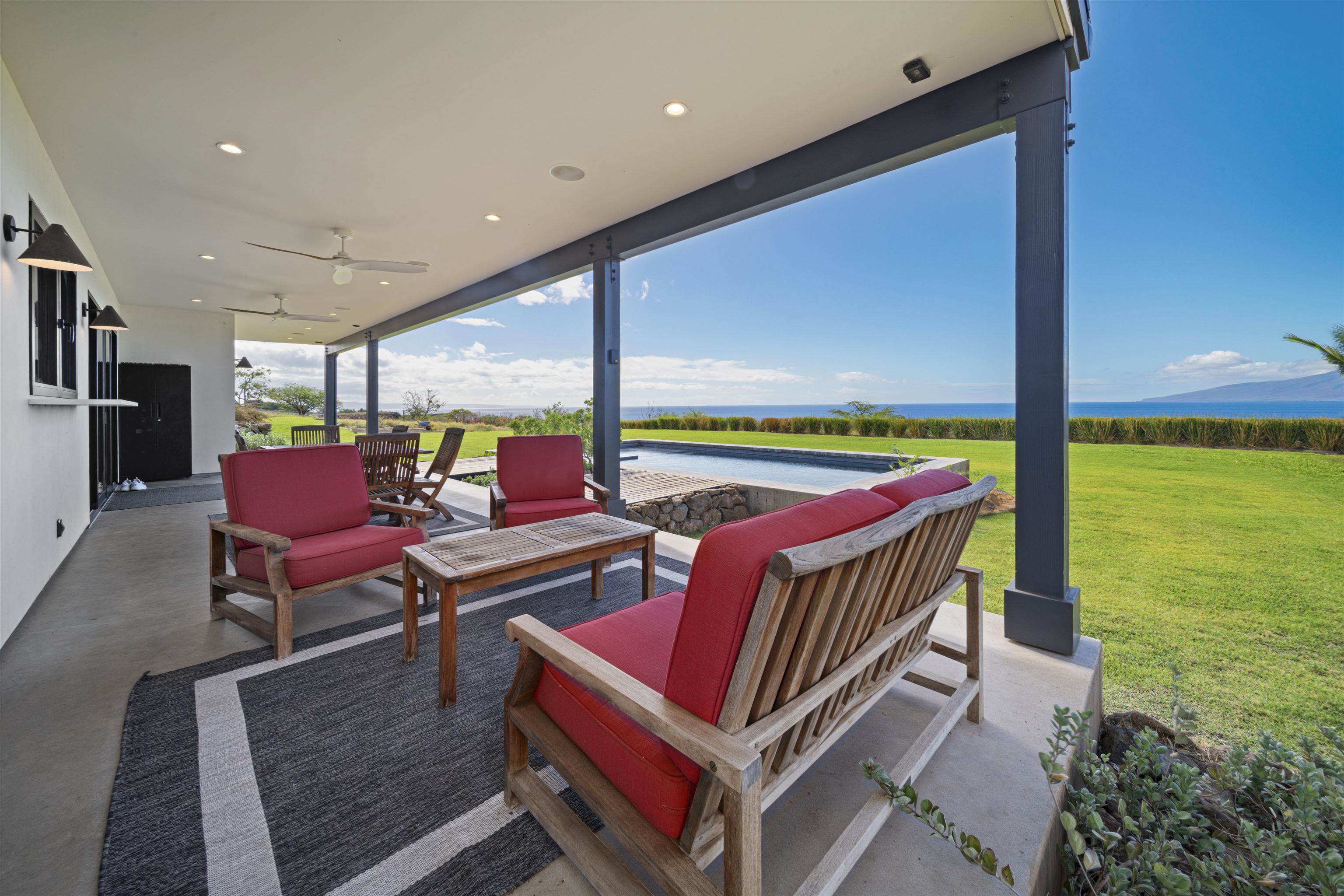 153 Haniu Street, Unit B Lahaina, HI 96761 - Photo 25 of 41 a living room with furniture and a flat screen tv