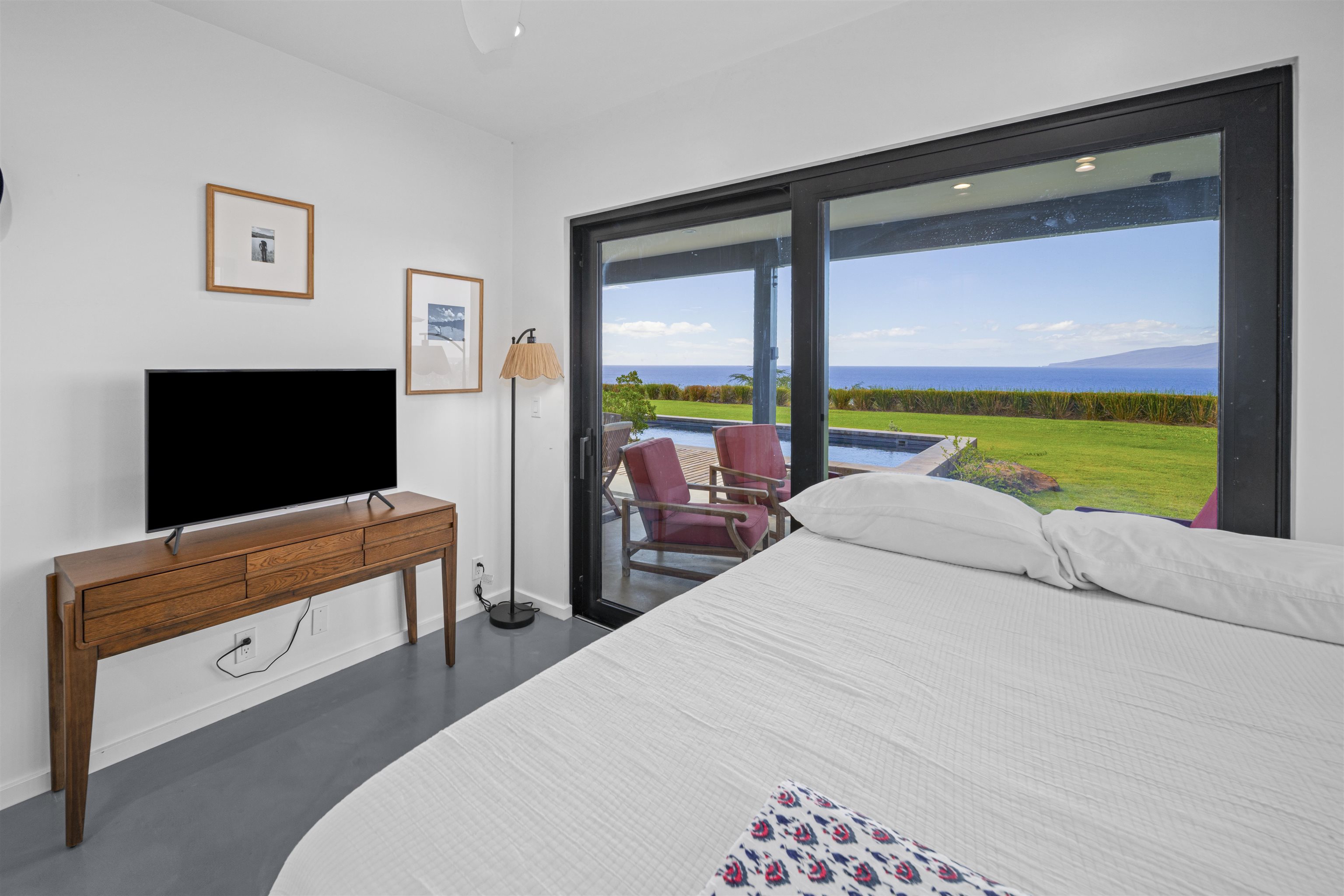 153 Haniu Street, Unit B Lahaina, HI 96761 - Photo 28 of 41 a bedroom with a bed and large window