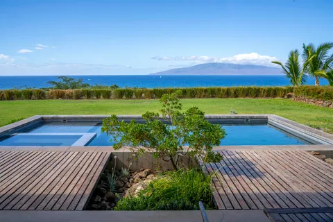 a view of swimming pool with a yard