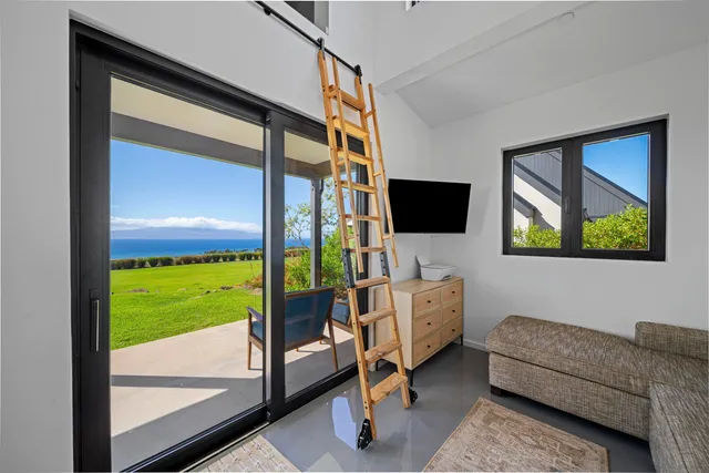 a view of a chairs and table in patio