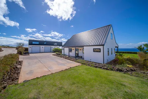 a view of a house with a back yard
