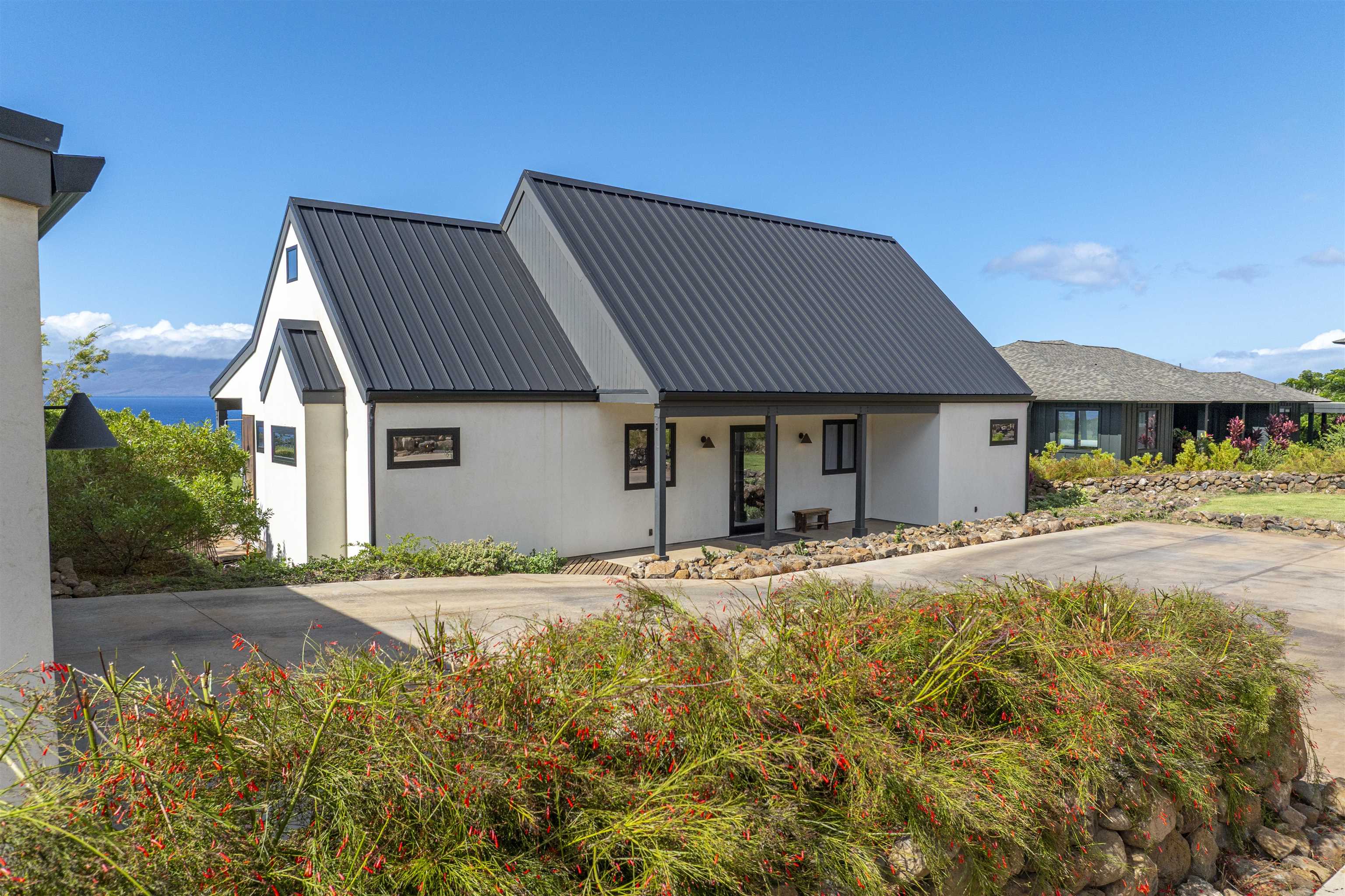 153 Haniu Street, Unit B Lahaina, HI 96761 - Photo 8 of 41 a front view of a house with a garden