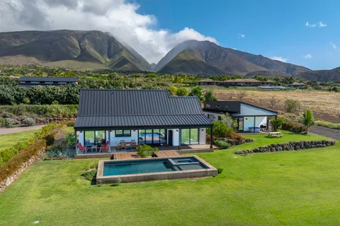 a garden view with a seating space and a lake view
