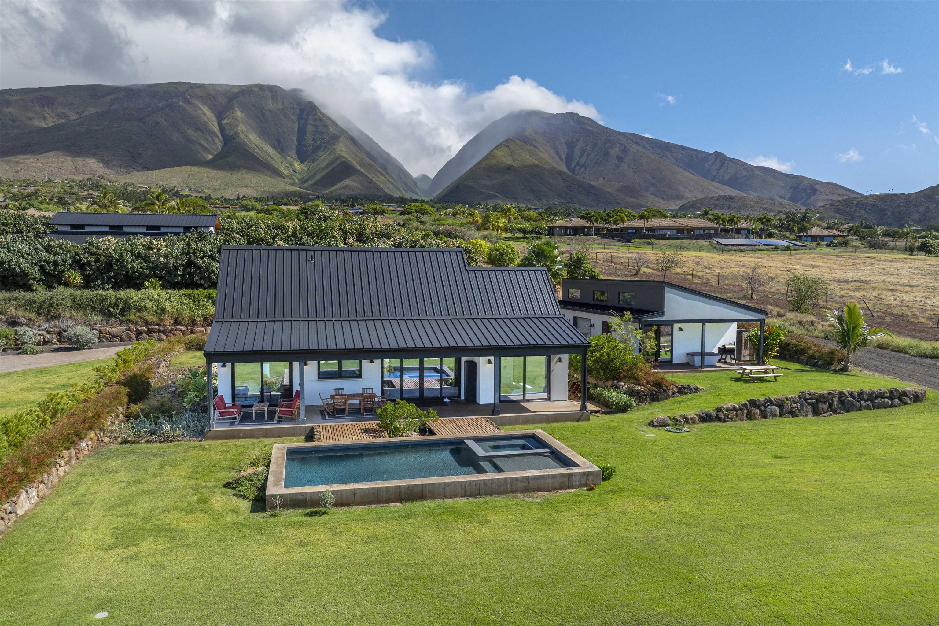 153 Haniu Street, Unit B Lahaina, HI 96761 - Photo 9 of 41 a garden view with a seating space and a lake view