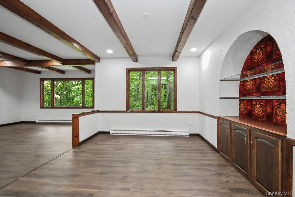 18 Hillside View Road Mahopac, NY 10541 - Photo 15 of 42 an empty room with wooden floor and windows