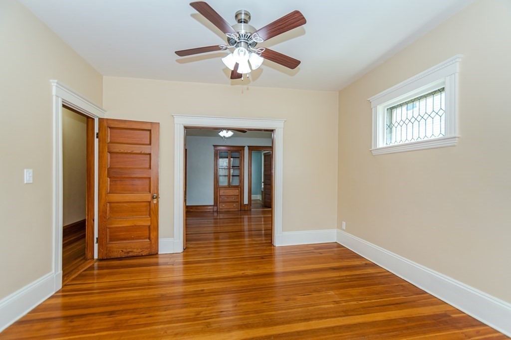 31 Morris Street Everett, MA 02149 - Photo 12 of 42 a view of an empty room with wooden floor