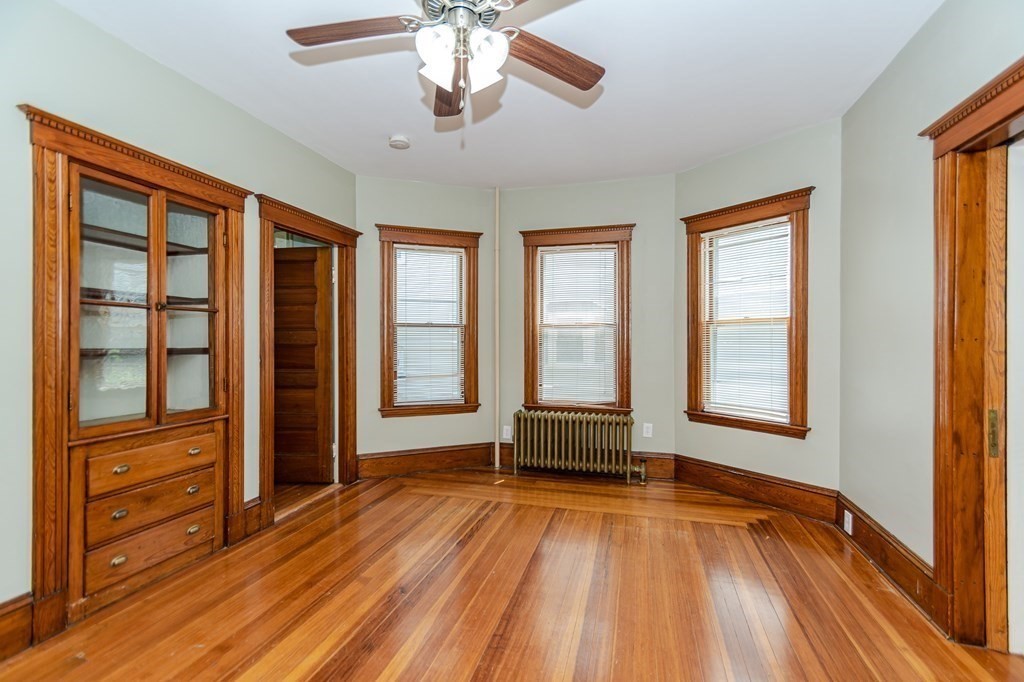 31 Morris Street Everett, MA 02149 - Photo 13 of 42 wooden floor and windows in a room with a window