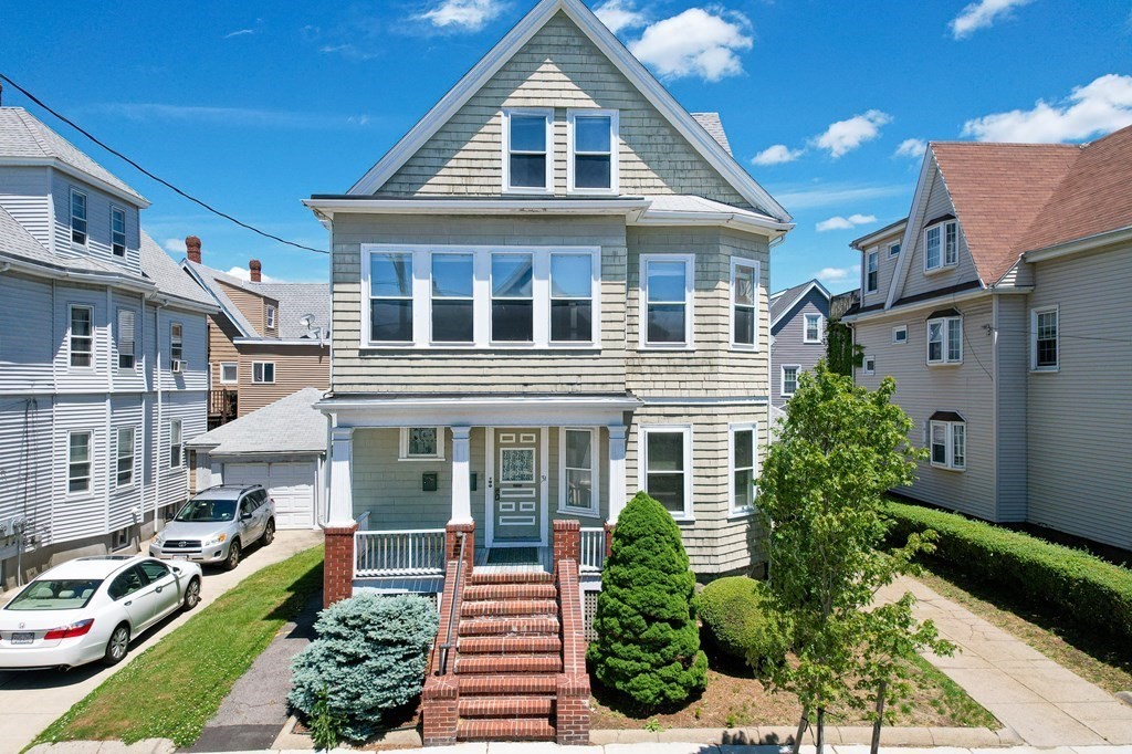 31 Morris Street Everett, MA 02149 - Photo 2 of 42 a front view of a house with a yard