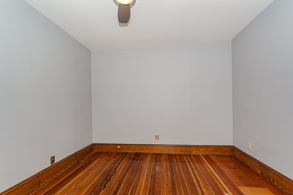 31 Morris Street Everett, MA 02149 - Photo 27 of 42 a view of an empty room with wooden floor