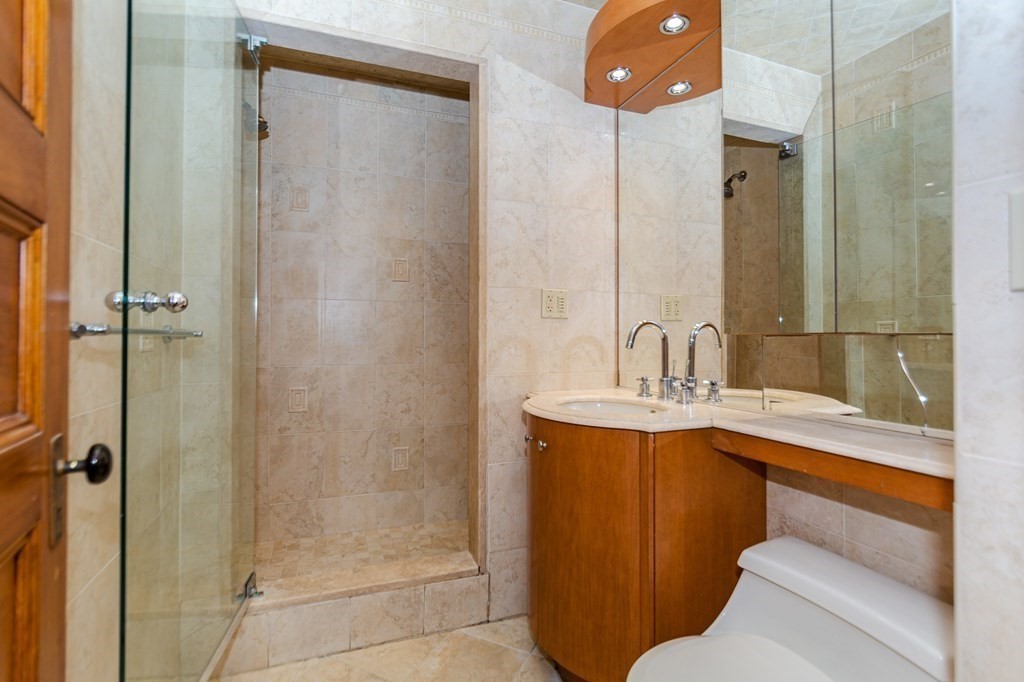 31 Morris Street Everett, MA 02149 - Photo 29 of 42 a bathroom with a sink and mirror