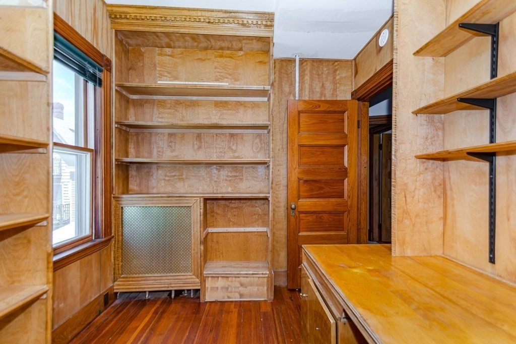 31 Morris Street Everett, MA 02149 - Photo 32 of 42 a view of walk in closet with empty racks