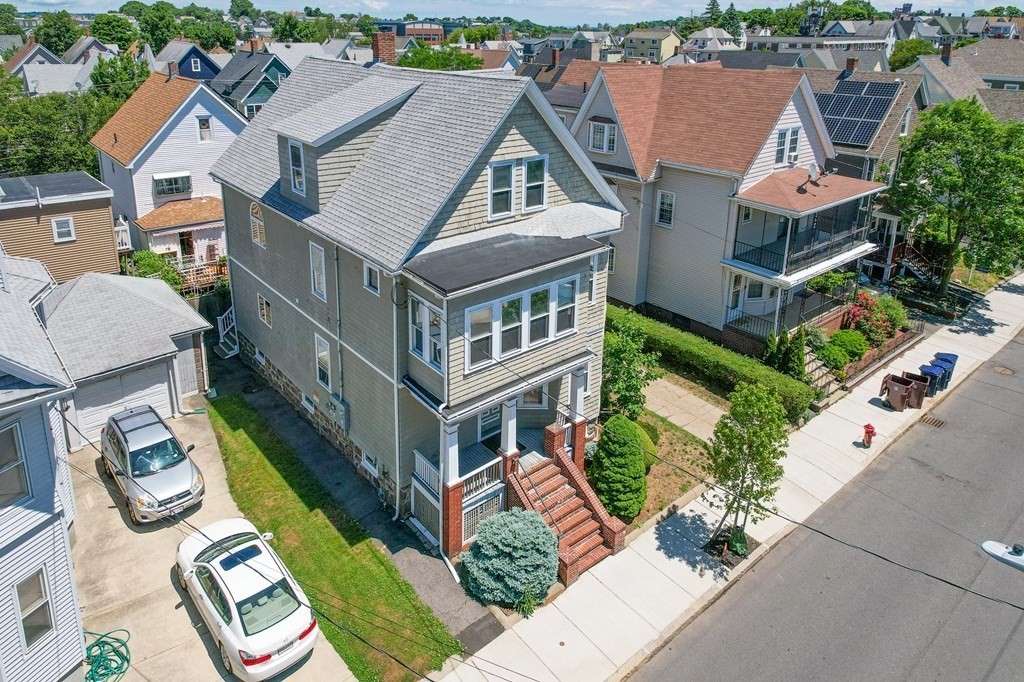 31 Morris Street Everett, MA 02149 - Photo 4 of 42 an aerial view of multiple houses with a yard