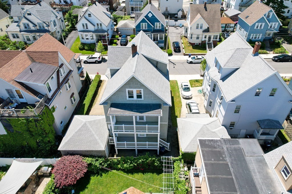 31 Morris Street Everett, MA 02149 - Photo 5 of 42 a aerial view of a house with a yard and potted plants