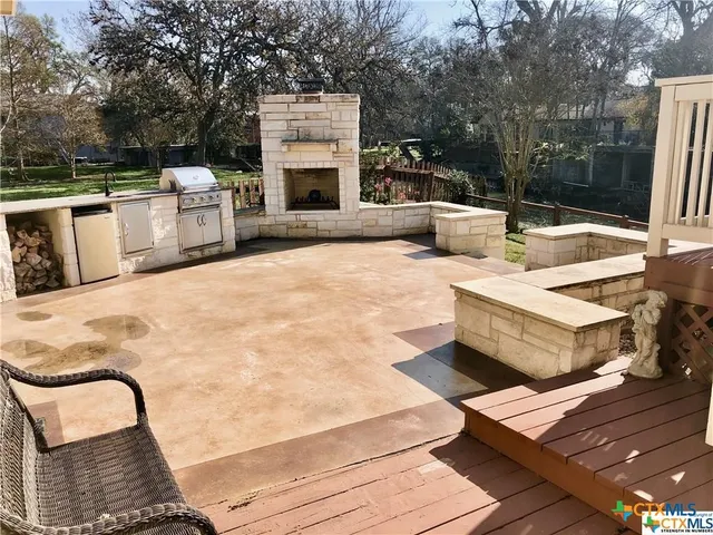 swimming pool view with a seating space