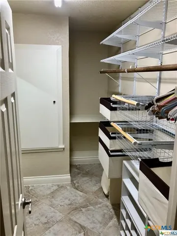 a kitchen with a stove and a refrigerator