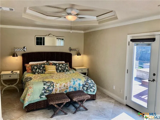 a bedroom with a bed and a table in it