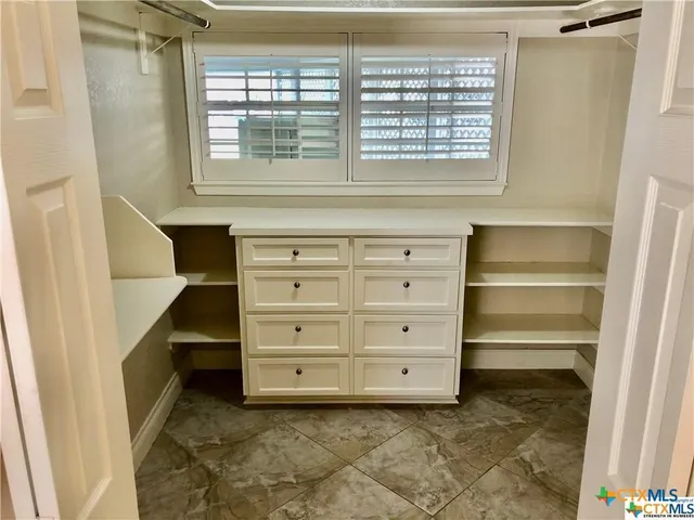 a view of an empty walk in closet
