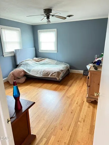 a white toilet sitting next to a bathroom sink and a shower