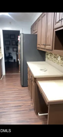 a view of kitchen sink and wooden floor