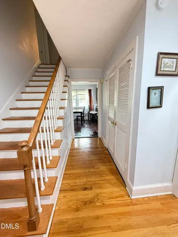 a view of entryway with wooden floor