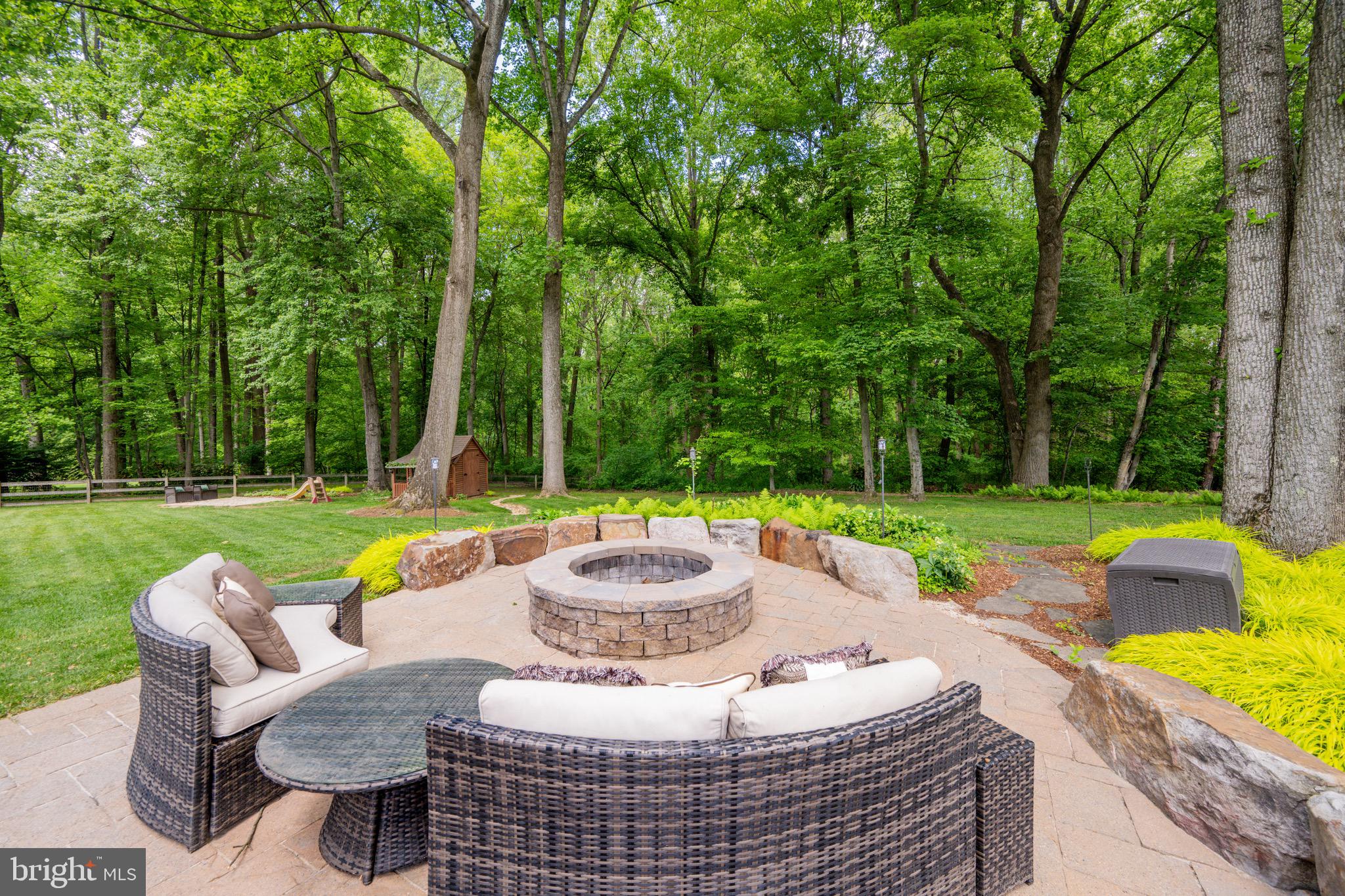 2 Wetherbee Court Phoenix, MD 21131 - Photo 9 of 19 a view of a patio with a table and chairs