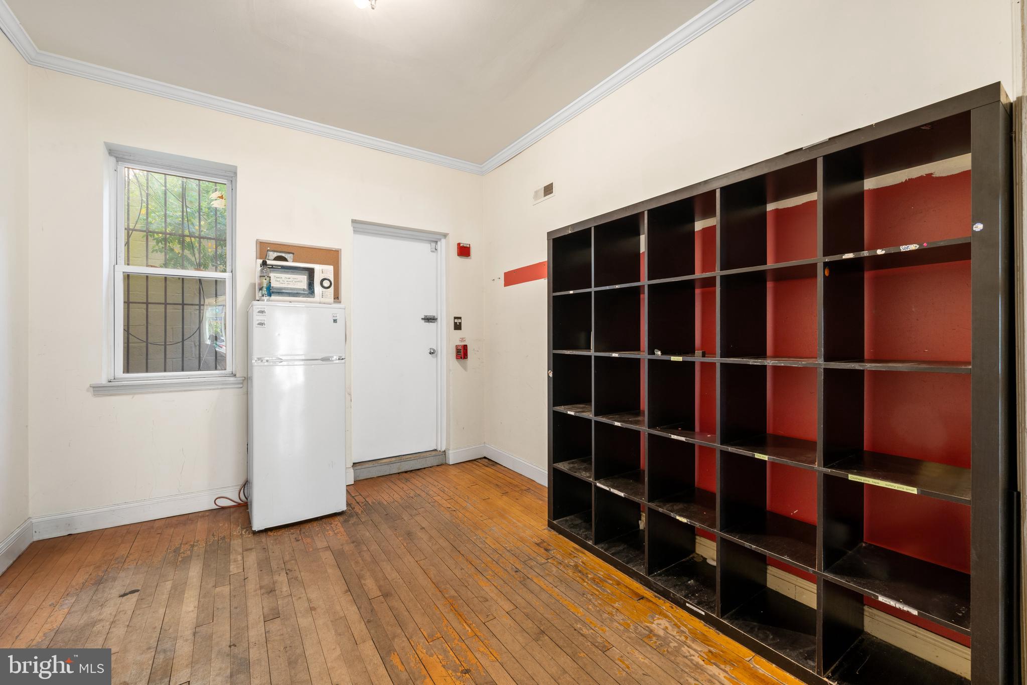 713 South 4th Street Philadelphia, PA 19147 - Photo 37 of 85 a view of empty room with wooden floor and windows