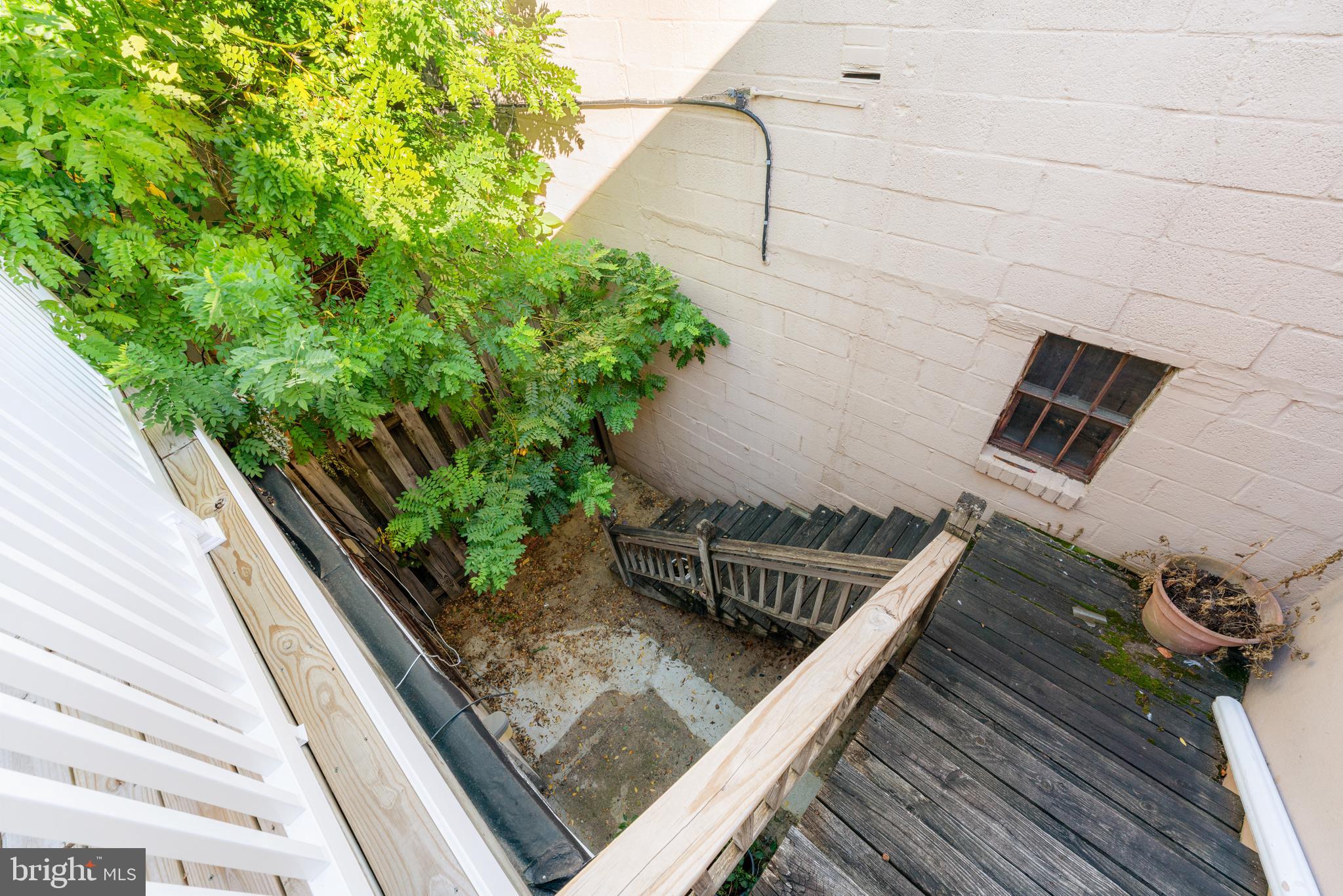 713 South 4th Street Philadelphia, PA 19147 - Photo 41 of 85 a view of a balcony with a couple of cars parked in front of a house
