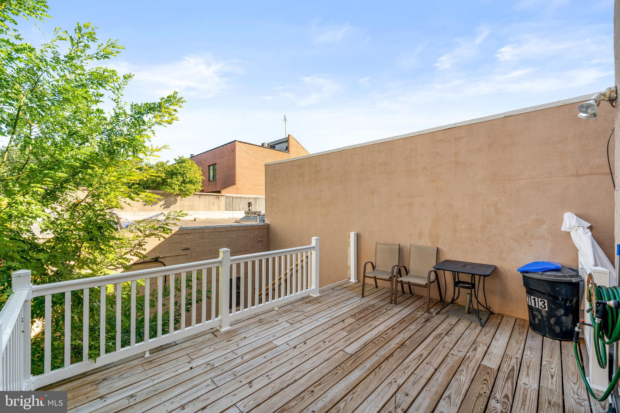 713 South 4th Street Philadelphia, PA 19147 - Photo 42 of 85 a view of a balcony with furniture and wooden floor