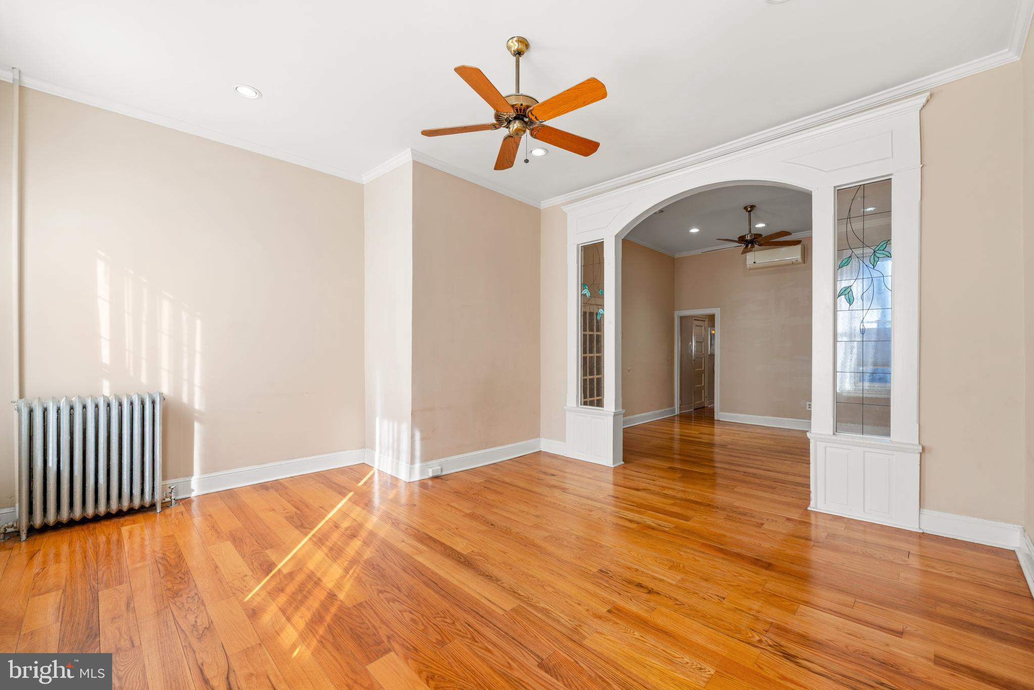 713 South 4th Street Philadelphia, PA 19147 - Photo 47 of 85 a view of a livingroom with wooden floor and a ceiling fan