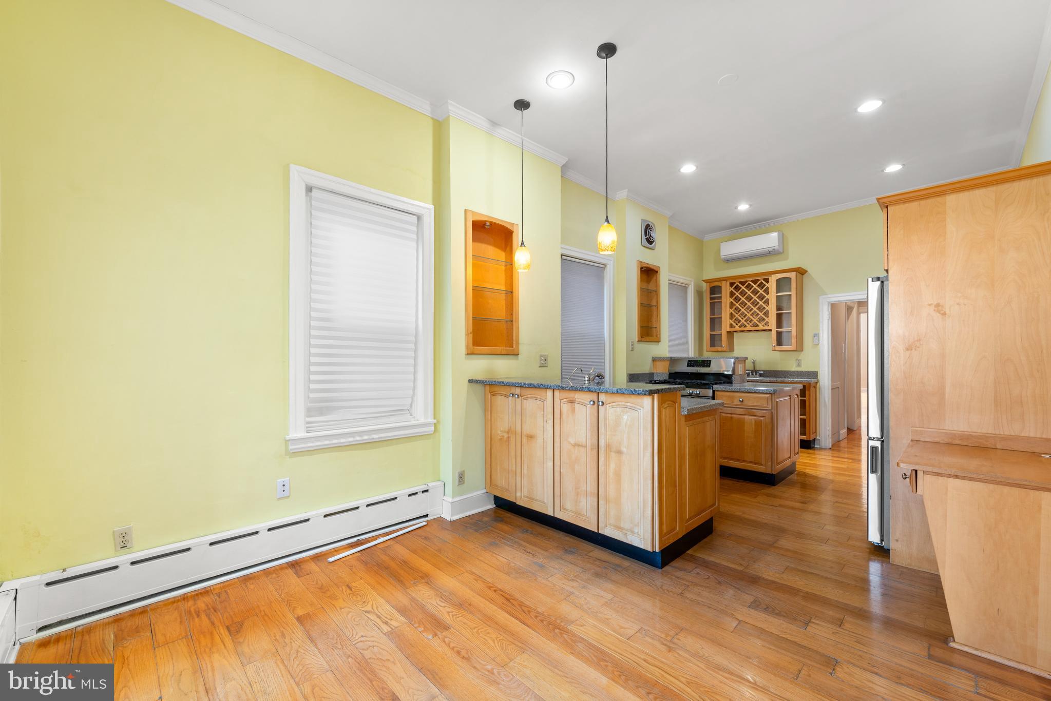 713 South 4th Street Philadelphia, PA 19147 - Photo 52 of 85 a kitchen with stainless steel appliances a refrigerator and a stove top oven