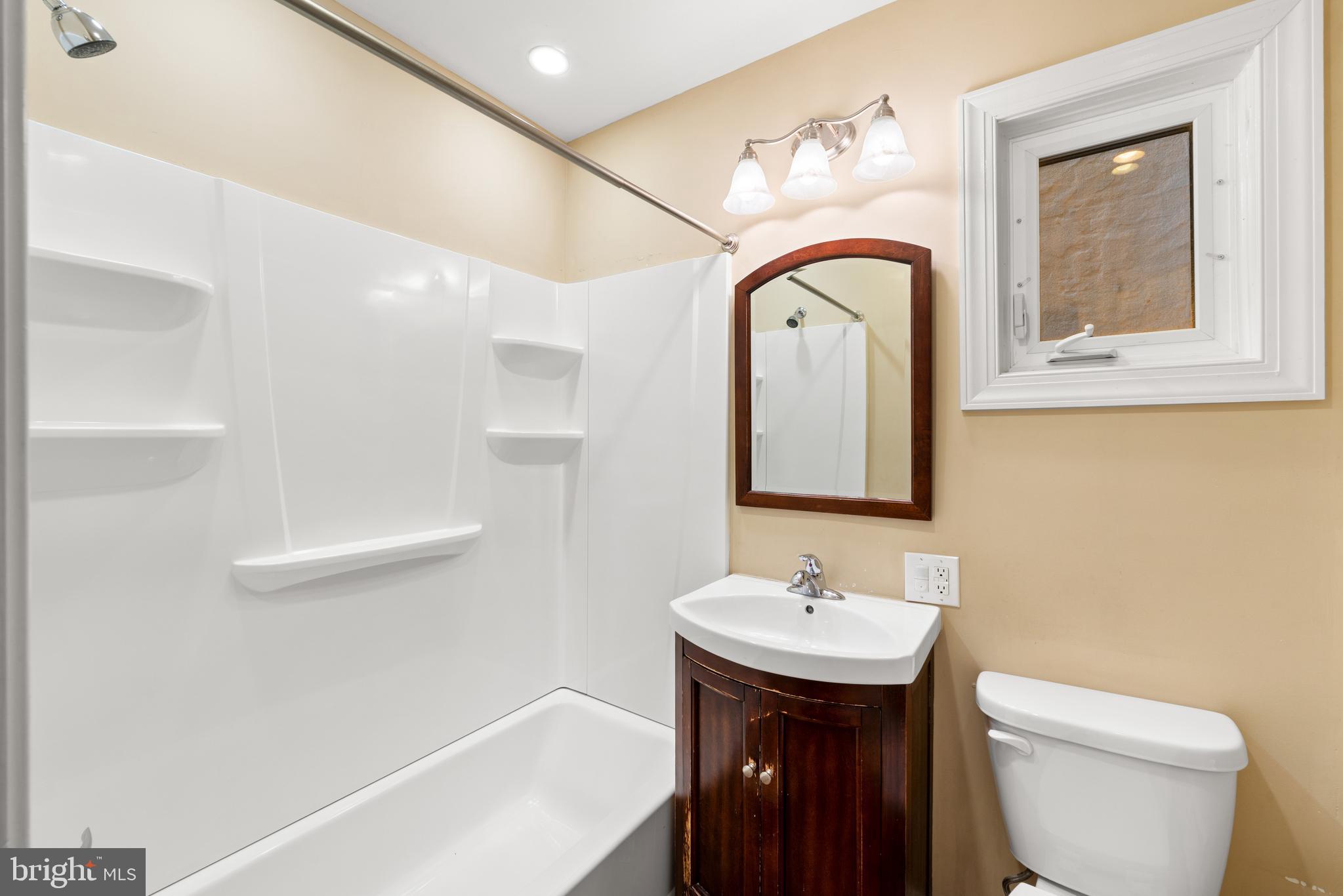 713 South 4th Street Philadelphia, PA 19147 - Photo 55 of 85 a bathroom with a sink a toilet and a mirror