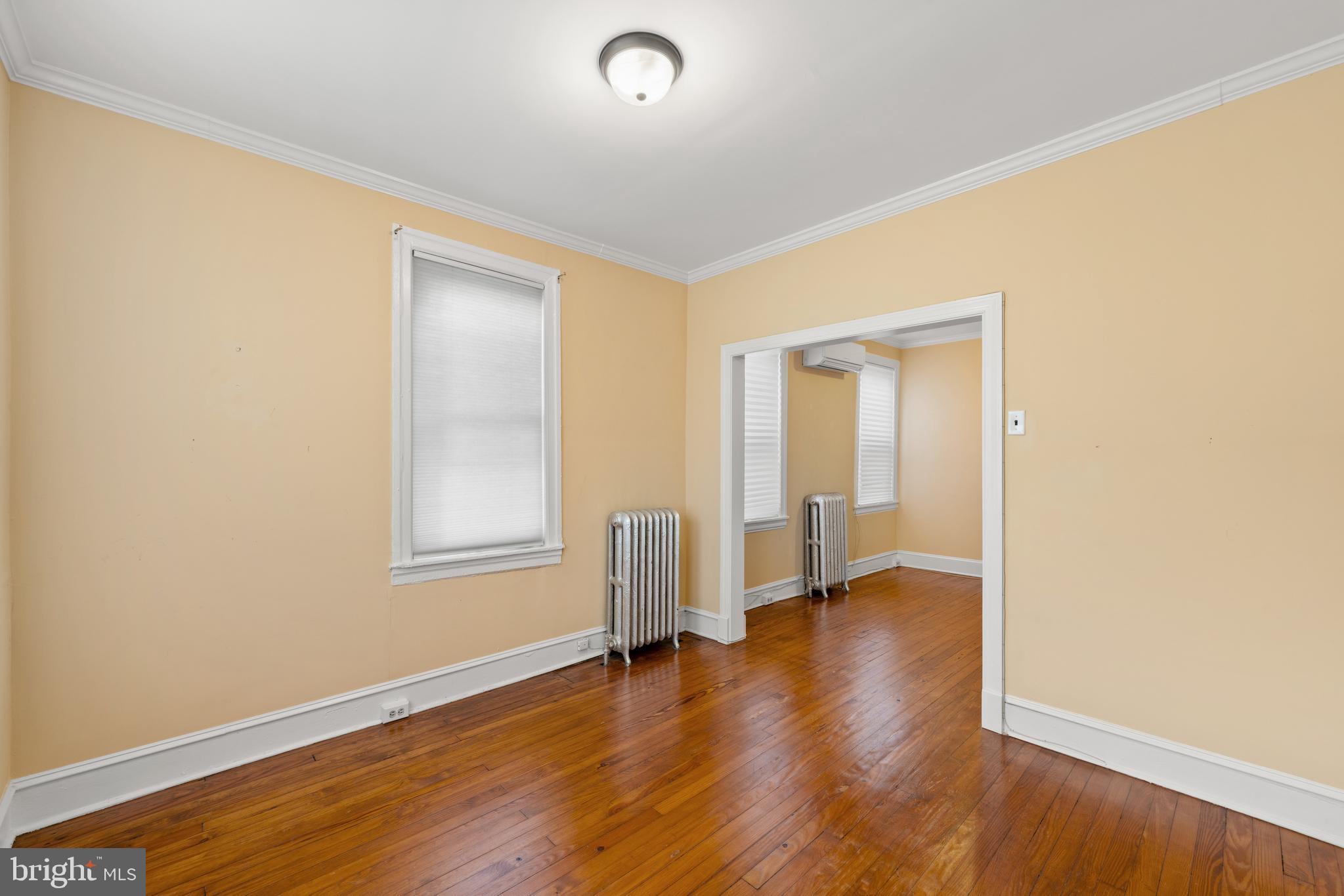 713 South 4th Street Philadelphia, PA 19147 - Photo 67 of 85 an empty room with wooden floor and windows