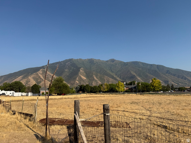496 North 300 West Mapleton, UT 84664 - Photo 6 of 49 Expansive open land featuring a wire fence and mountain backdrop