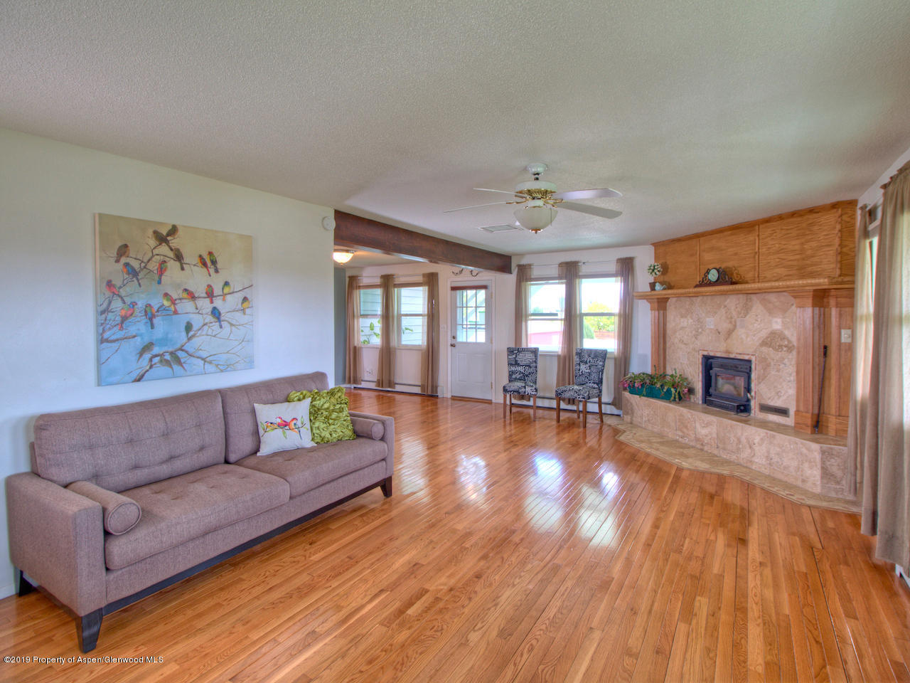 1763 K 6/10 Road Fruita, CO 81521 - Photo 15 of 29 a living room with furniture and a fireplace