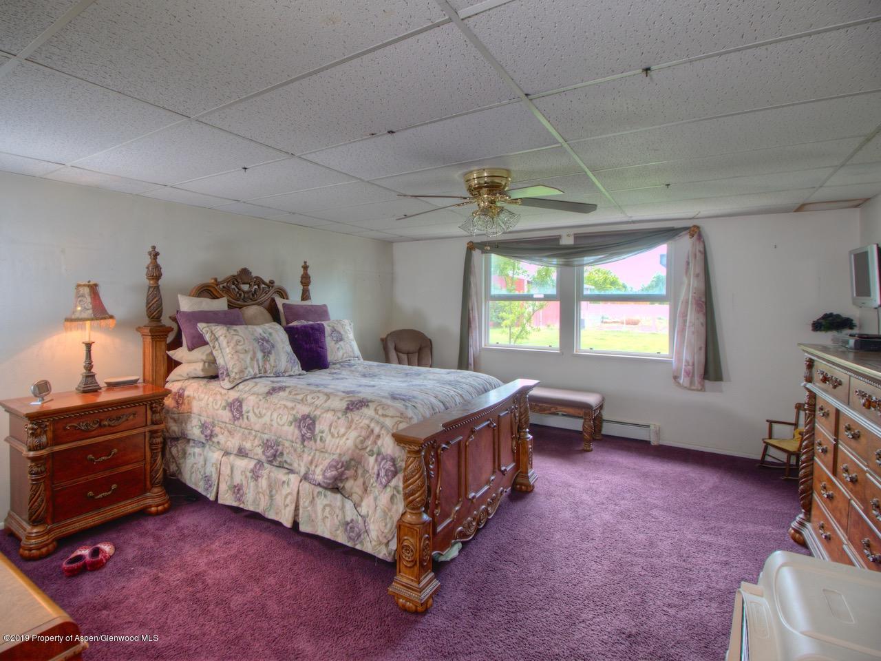 1763 K 6/10 Road Fruita, CO 81521 - Photo 26 of 29 a bedroom with a bed and a window