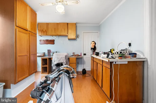 a bedroom with bed and a chandelier