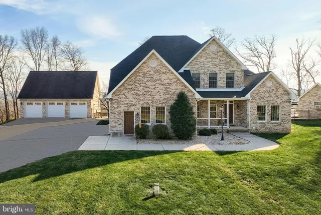 a front view of a house with a yard patio and fire pit