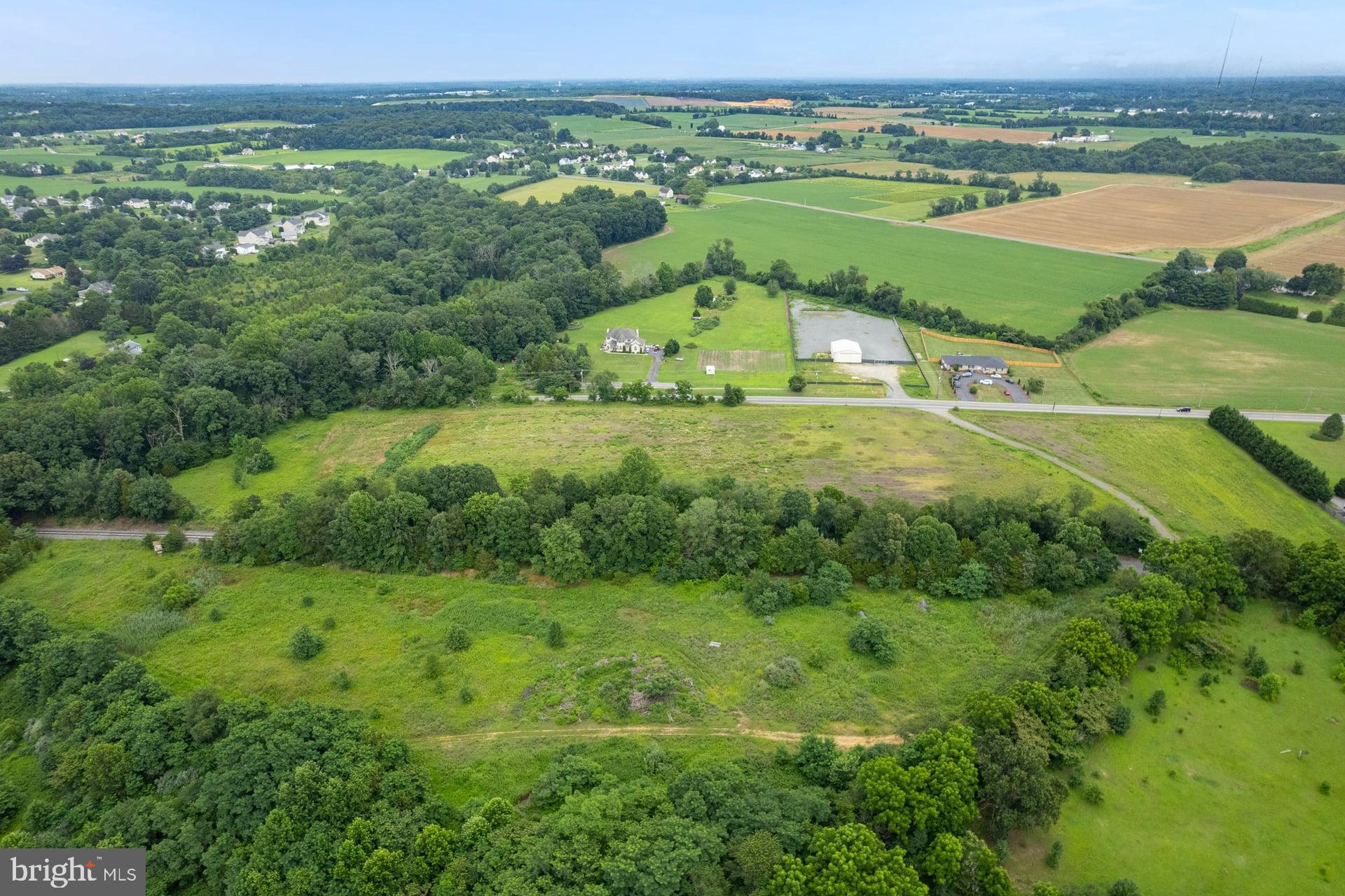 555 Woodstown Road Swedesboro, NJ 08085 - Photo 4 of 19 an aerial view of a house with a yard
