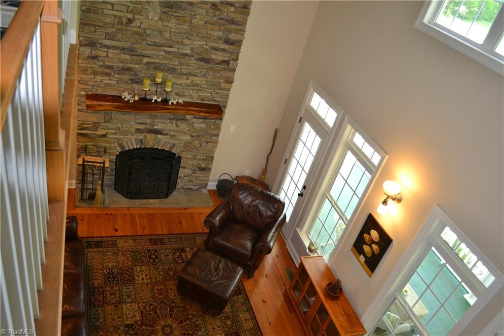 1484 Smothers Road Madison, NC 27025 - Photo 15 of 30 Family room and fire place as seen from the loft.