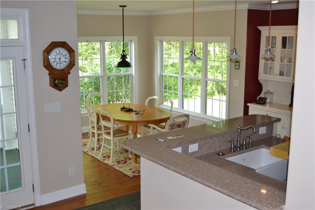 1484 Smothers Road Madison, NC 27025 - Photo 18 of 30 Breakfast nook with lots of wonderful windows to welcome your day.