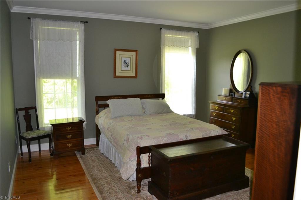 1484 Smothers Road Madison, NC 27025 - Photo 20 of 30 Generous main floor master bedroom with large walk in closet and master bathroom.
