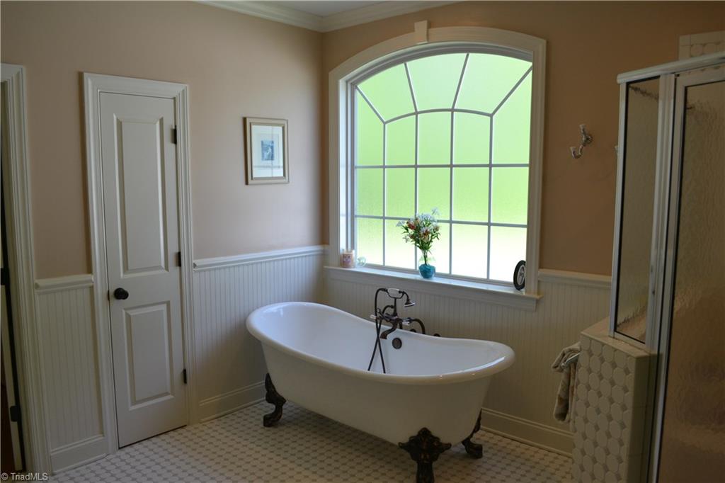1484 Smothers Road Madison, NC 27025 - Photo 21 of 30 After a long day of riding, relax with a nice glass of wine in the large claw foot tub.