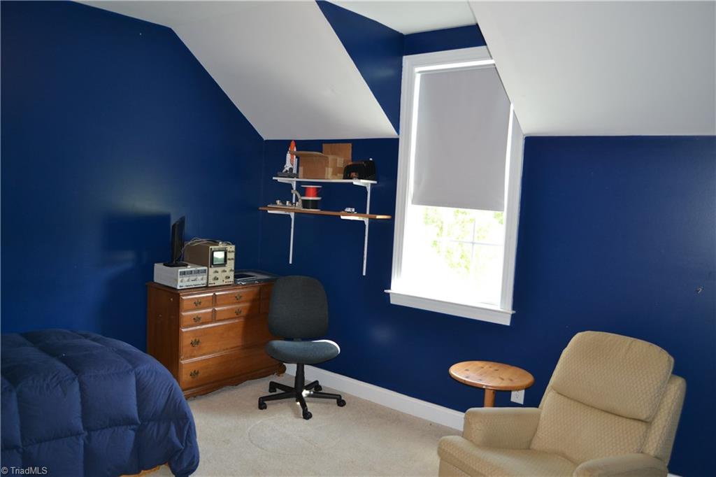 1484 Smothers Road Madison, NC 27025 - Photo 27 of 30 The second of three upstairs bedrooms features a large walk in closet and private access to the main second floor bathroom. The second floor bathroom features a large sink and separate water closet and tub/shower room.