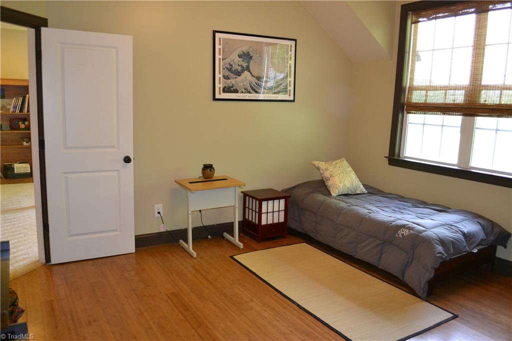 1484 Smothers Road Madison, NC 27025 - Photo 28 of 30 Third second story bedroom. This room features bamboo floors and large walk in closet.