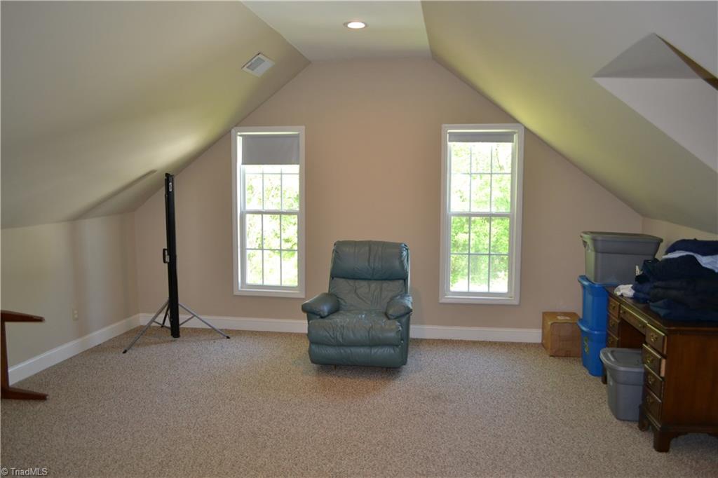 1484 Smothers Road Madison, NC 27025 - Photo 29 of 30 Large second story bonus room. This room features a full height door to access the large second story storage area (unheated).
