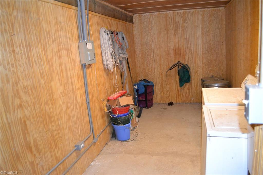 1484 Smothers Road Madison, NC 27025 - Photo 8 of 30 Heated tack room with concrete floor, sink, and washer/dryer. See agent only notes for additional information