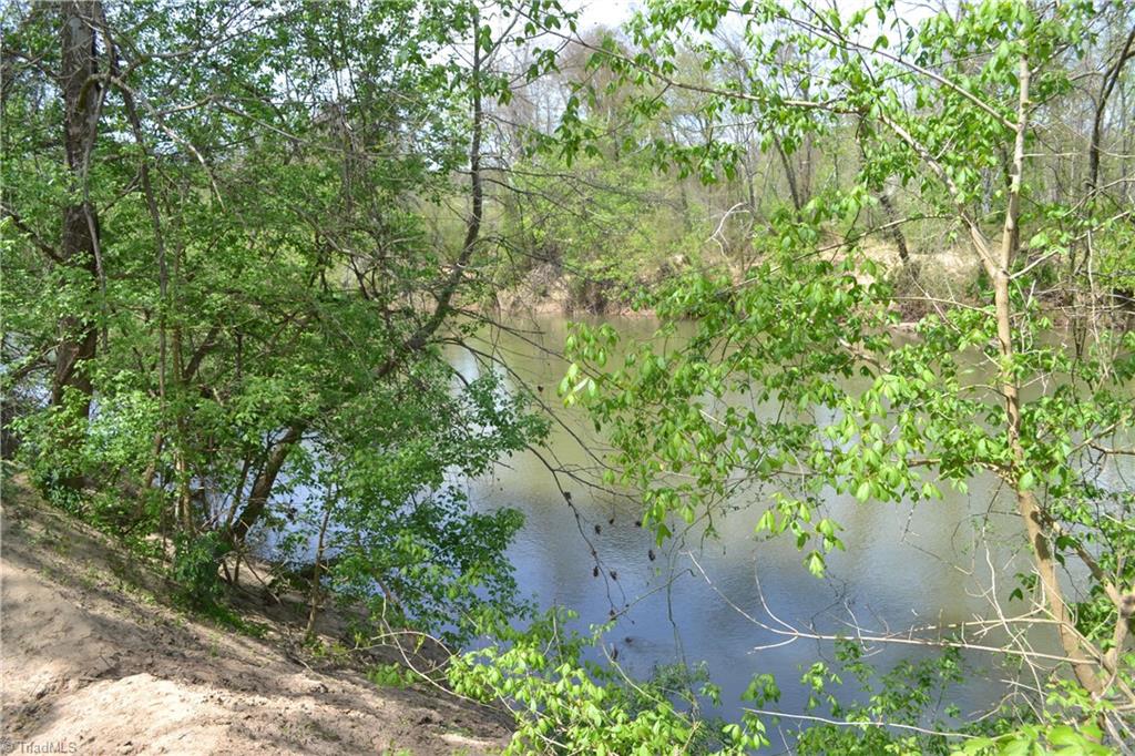1484 Smothers Road Madison, NC 27025 - Photo 10 of 30 With this property you have almost 1/4 mile of river frontage. This is the perfect spot to put in your canoe or kayak for day on the water. Upstream west of Madison is another access point perfect for floating back to your new home. Bring your fishing rod and enjoy a shore lunch after a day on the water. Near this spot is the perfect location for family camping by the river.