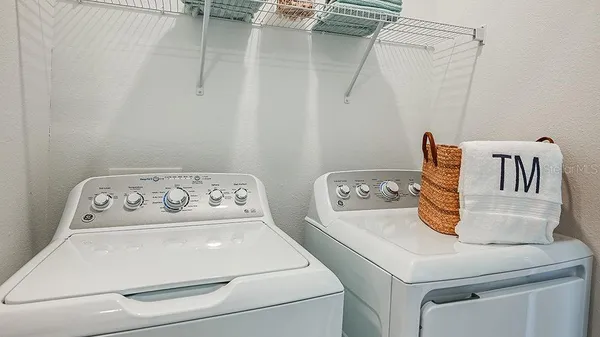 a utility room with dryer and washer