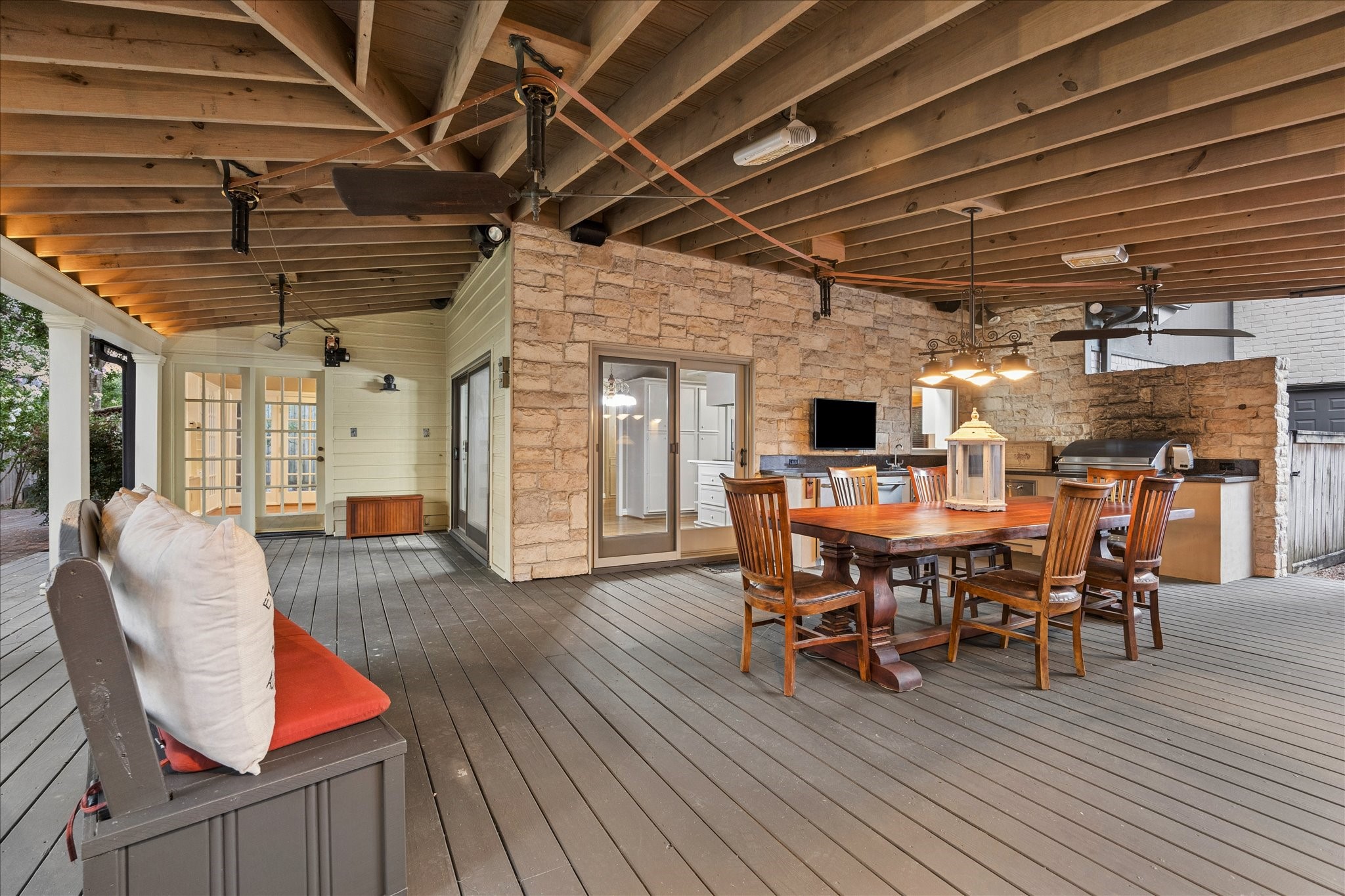 636 Rancho Bauer Drive Houston, TX 77079 - Photo 5 of 42 The large covered deck has an abundant space for entertaining. A unique Woolen Mills belt driven ceiling fan system and heaters add to the comfort year round.
